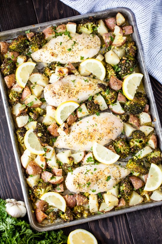 Bird's eye view of a Sheet Pan full of  Garlic Parmesan Chicken Broccoli and Potatoes. 