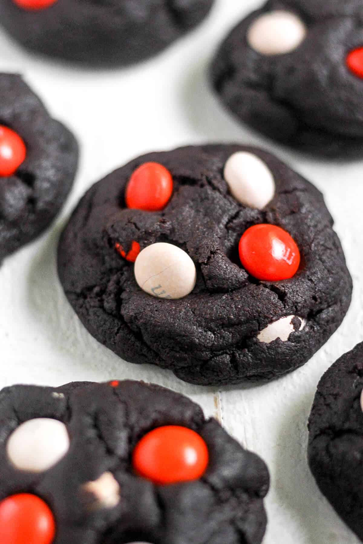 Get ready for your spooky celebration! These Dark Chocolate Halloween Cookies are a great addition to any party spread. They're soft, chewy, filled with chocolate and decorated with festive candy.