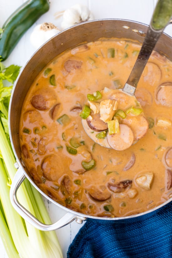 cajun white chicken chili in stockpot with ladle scooping