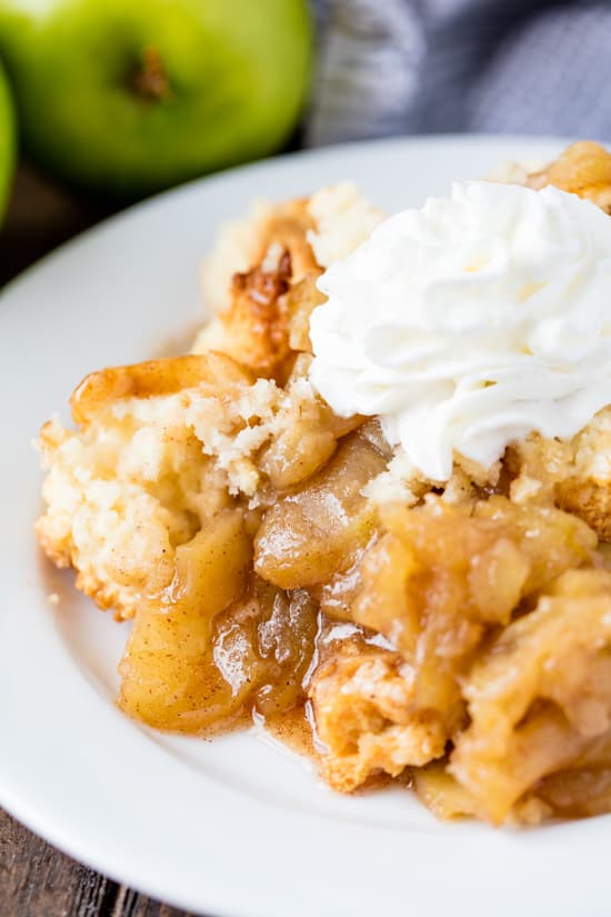 Skillet Apple Cobbler served on a plate with a dollop of whipped cream