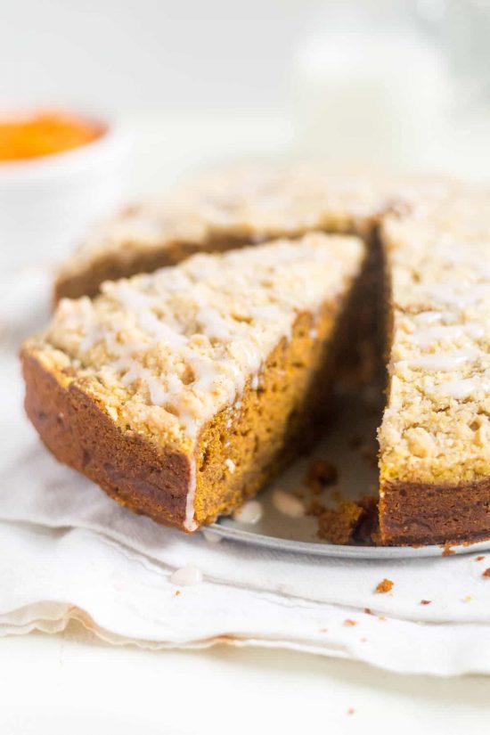 Pumpkin Gingerbread Coffee Cake with a slice cut, ready to eat