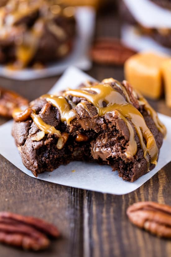 A Chocolate Turtle Cookie with a bite taken out