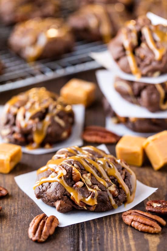 Chocolate Turtle Cookies surrounded by caramels and pecans