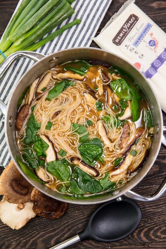 A pot of Miso Noodle Soup with Miwa somen noodles, shitake mushrooms, spinach and green onion