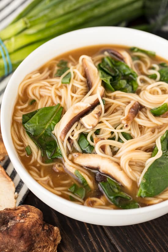 A bowl of Noodle Miso Soup with Miwa somen noodles, with shitake mushrooms, spinach and green onion