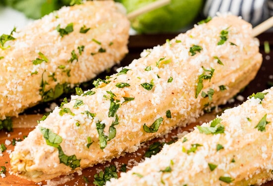 Authentic Mexican Street Corn rolled in a creamy mayonnaise/crema mixture and topped with cotija cheese and cilantro