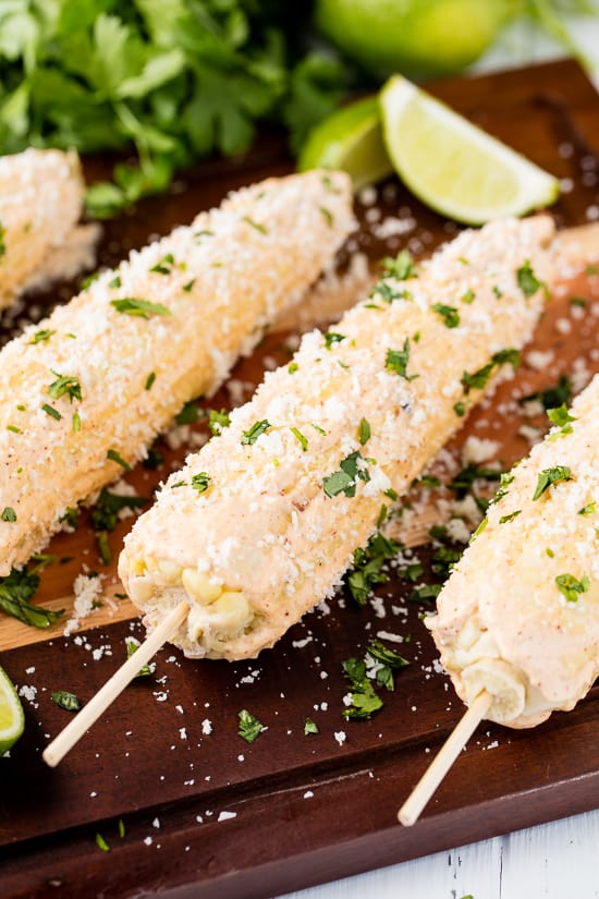 Authentic Mexican Street Corn rolled in a creamy mayonnaise/crema mixture and topped with cotija cheese and cilantro