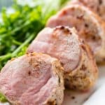 Pork tenderloin is seared and baked in a garlic butter sauce for a perfectly tender baked  Garlic Butter Pork Tenderloin