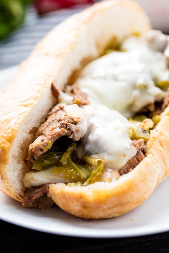 Philly Cheese Steak with green bell peppers and Kraft provolone cheese on a hoagie roll