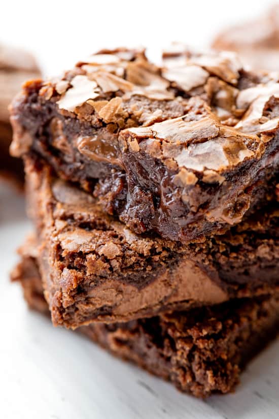 Close up of three Brownie squares stacked on each other.