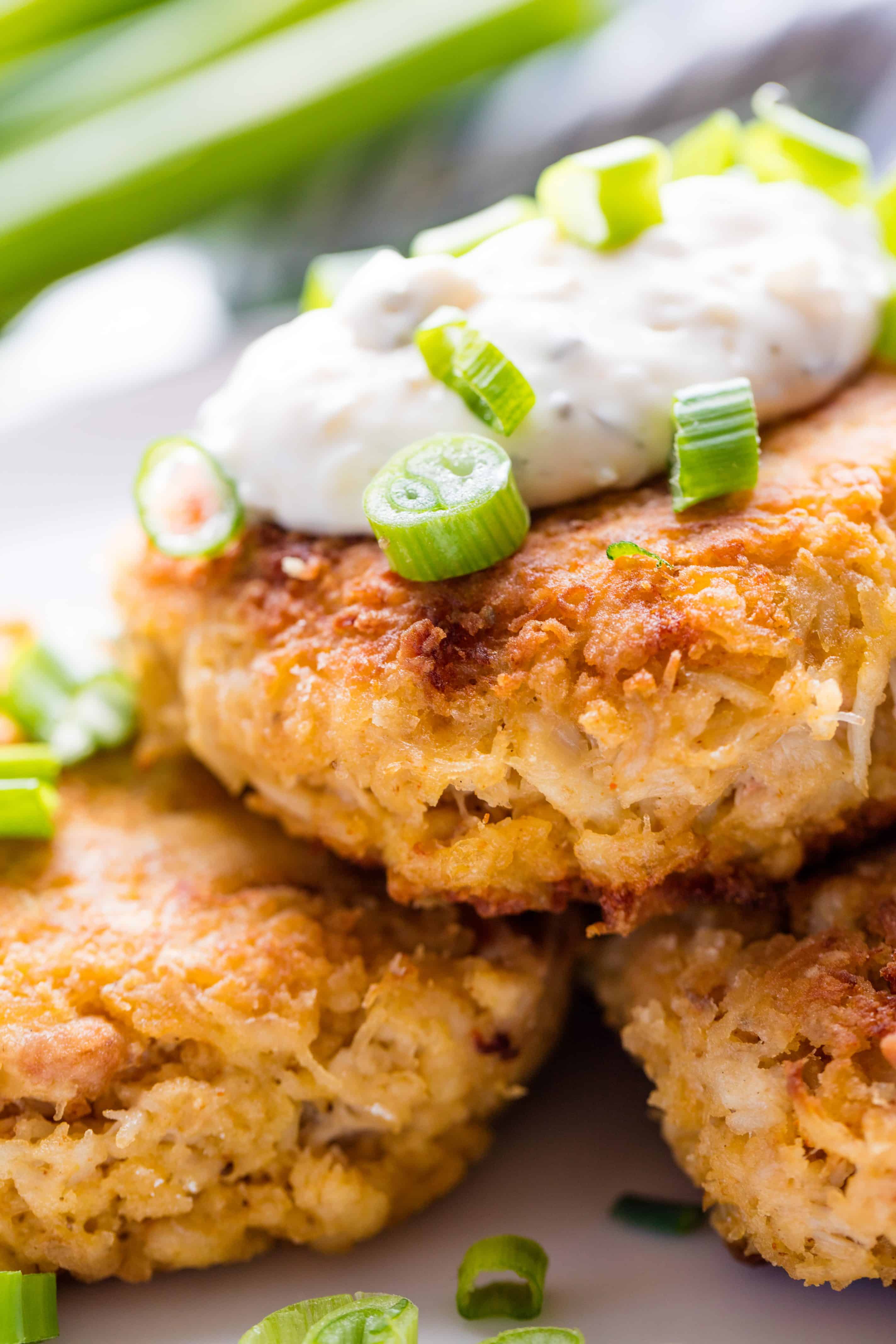 Close up shot of Crab Cakes to show the flakiness of the crust.