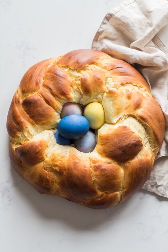 Easter Bread braided into a nest with dyed easter eggs in the center