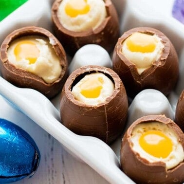 Several cheesecake filled chocolate easter eggs with their tops broken off