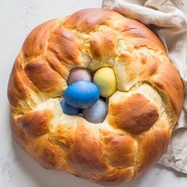 Easter Bread braided into a nest with dyed easter eggs in the center