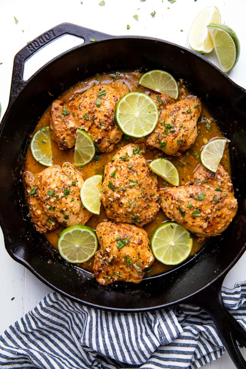 Garlic lime chicken in a cast-iron skillet.