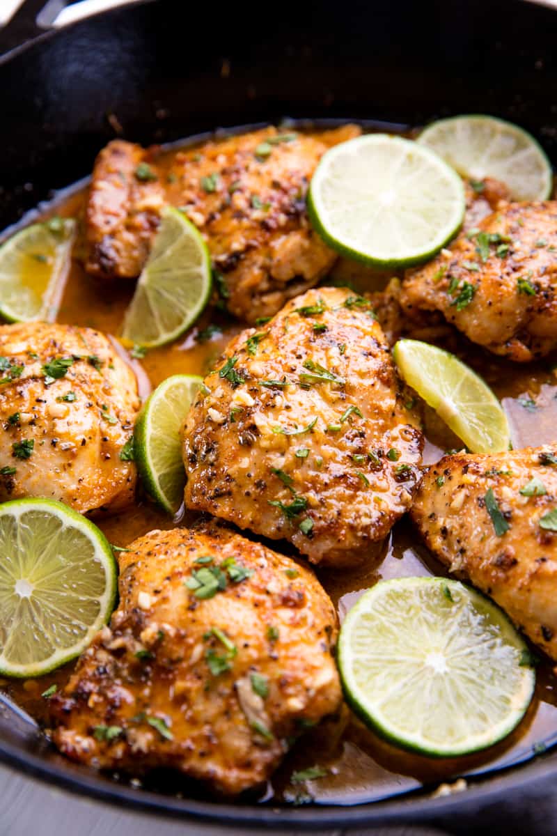 Close up of Garlic lime chicken in a cast iron skillet.