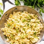 Spaetzle in a stainless steel frying pan.