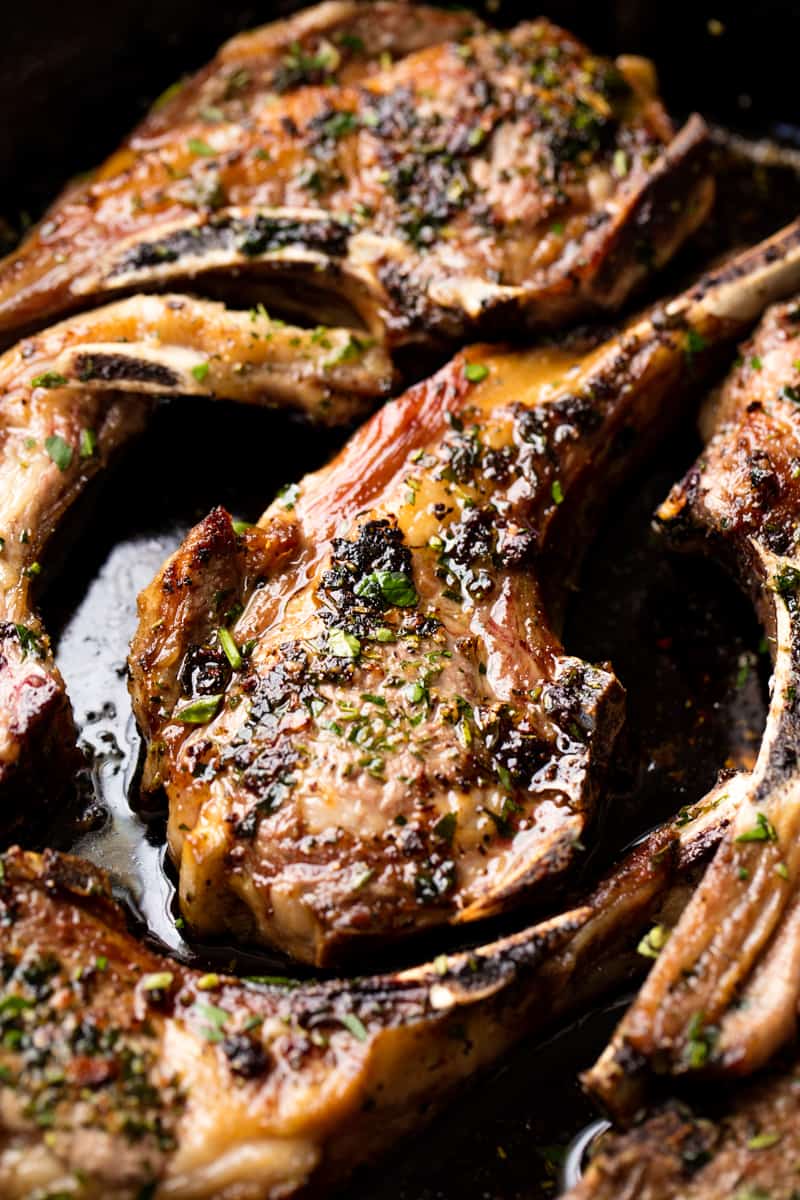 Close up on Lamb Chops to show oil and seasonings.