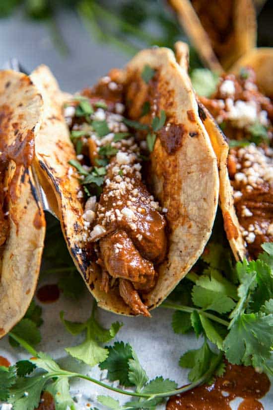 Typically labored over and simmered for hours Slow Cooker Chicken Mole Tacos