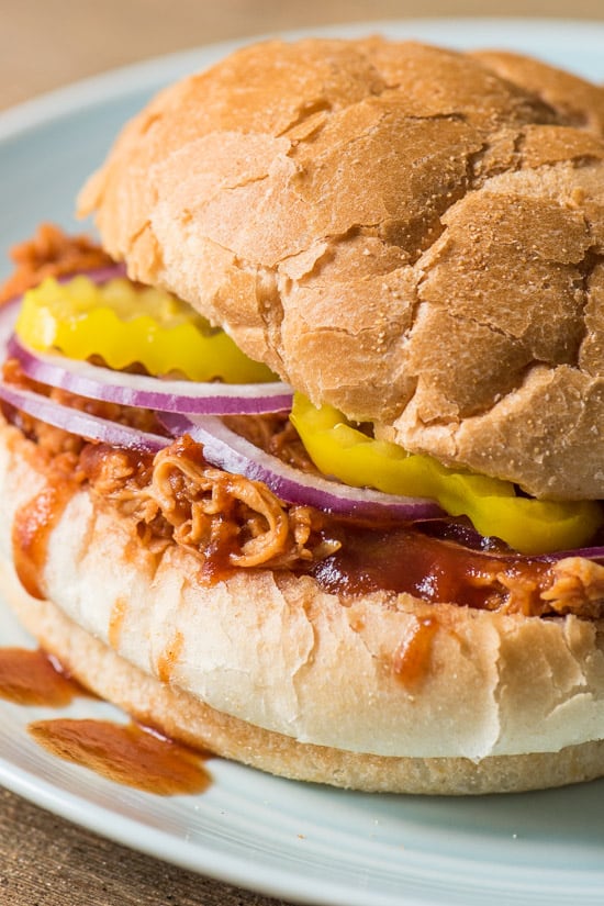 Close up of BBQ Chicken sandwich on a white plate.