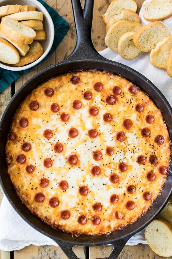 A cheesy pepperoni pizza dip made with a cream cheese base and topped off with pizza sauce Easy Baked Pizza Dip