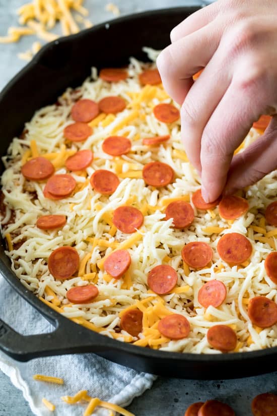 A cheesy pepperoni pizza dip made with a cream cheese base and topped off with pizza sauce Easy Baked Pizza Dip