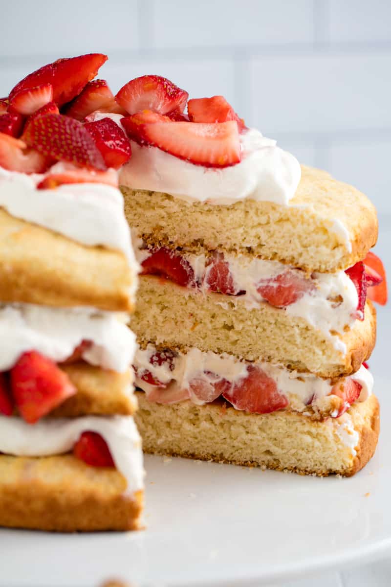 Strawberry Shortcake with a slice taken out of it.