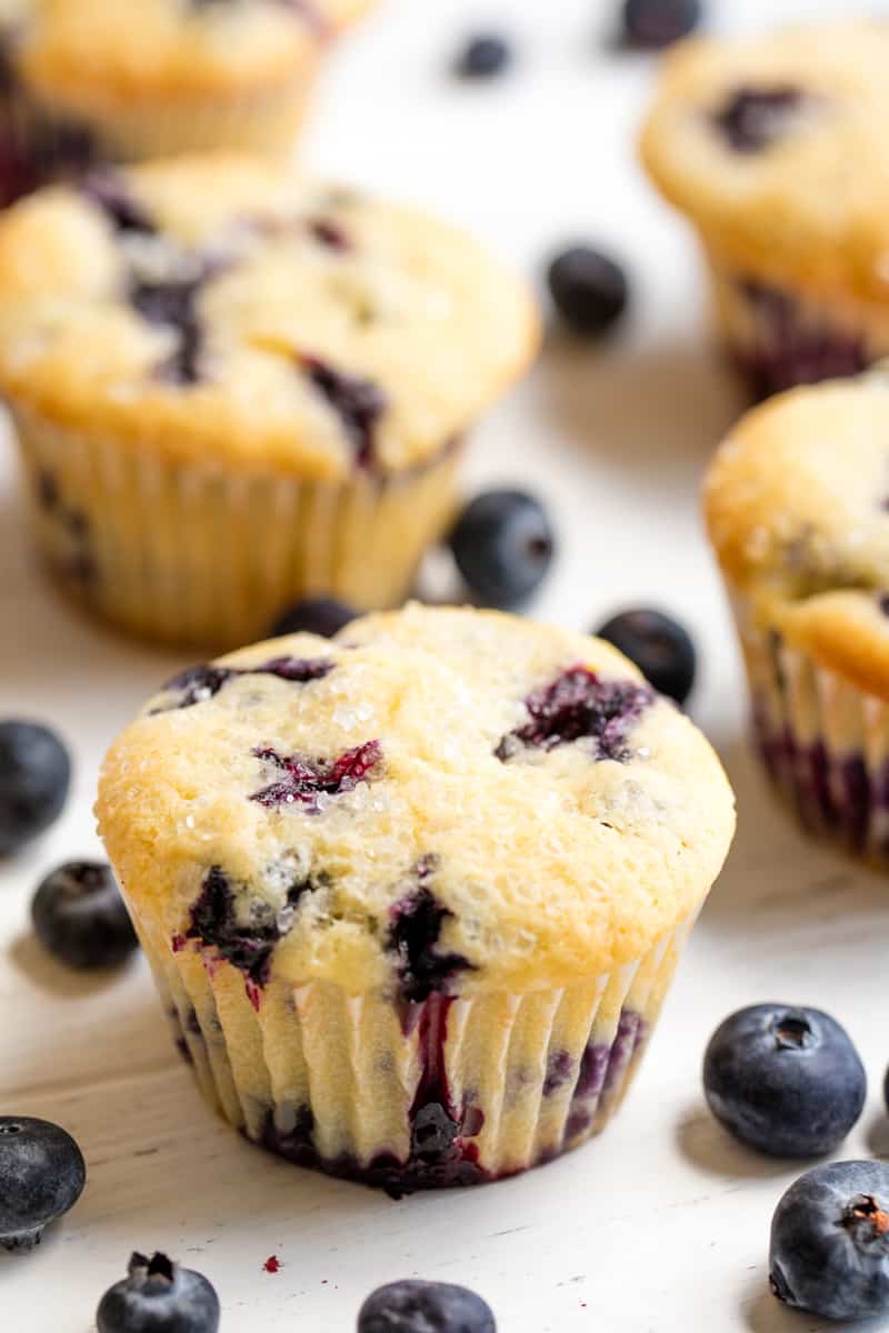 Blueberry Muffins and blueberries on a white countertop