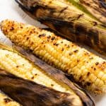 Grilled Corn on the cob on a countertop.