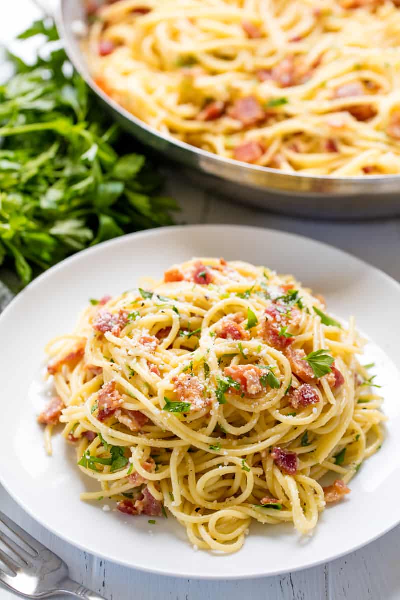 Pasta Carbonara served up on a white plate. 