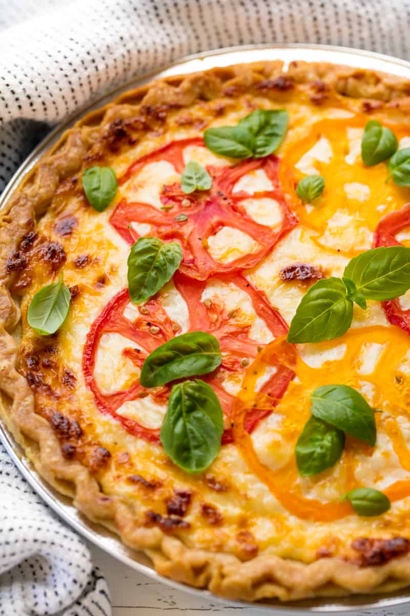 Savory Southern Tomato Pie in a pie tin