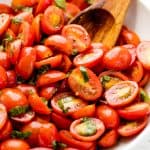 balsamic tomato salad in a white bowl