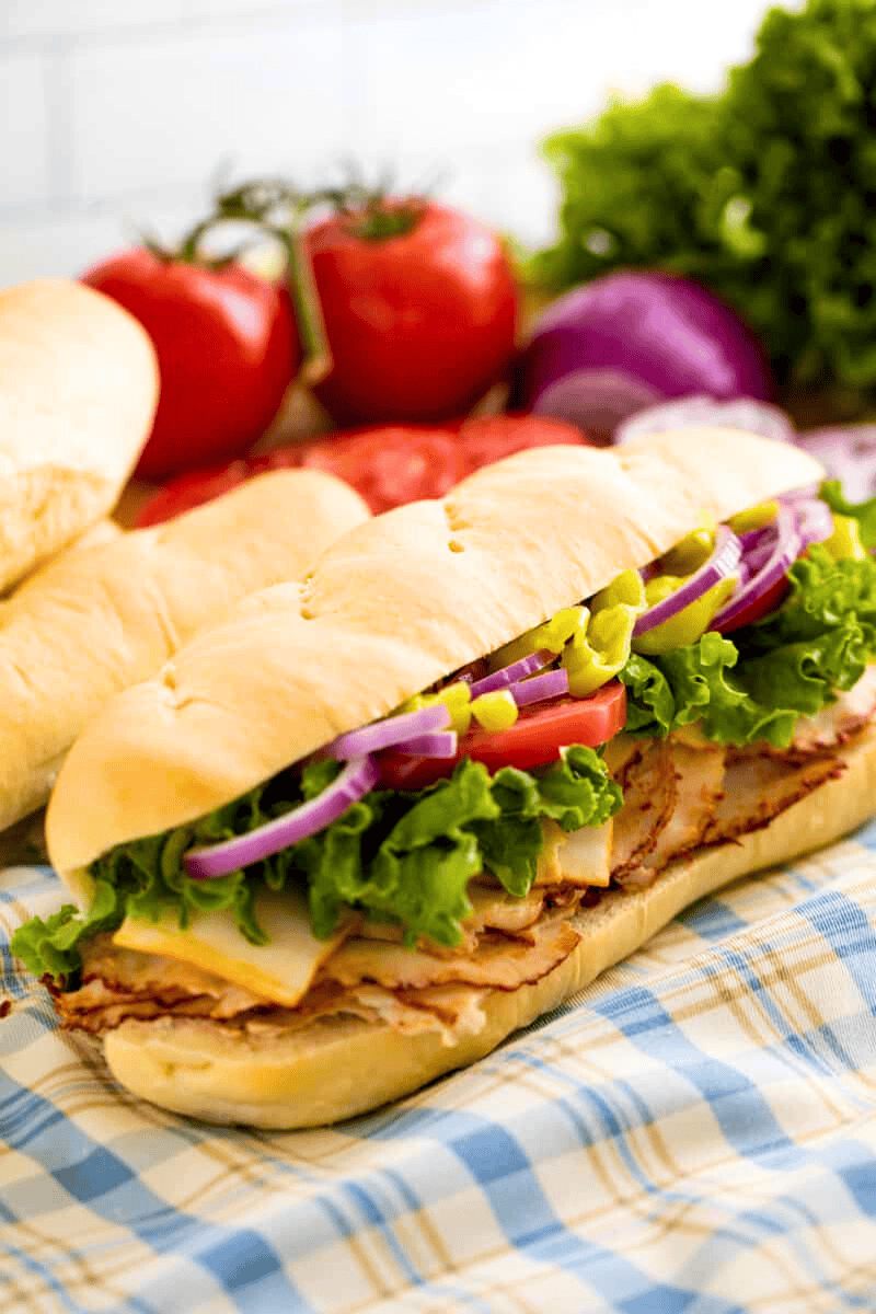 A loaded hoagie sandwich on a homemade hoagie roll.