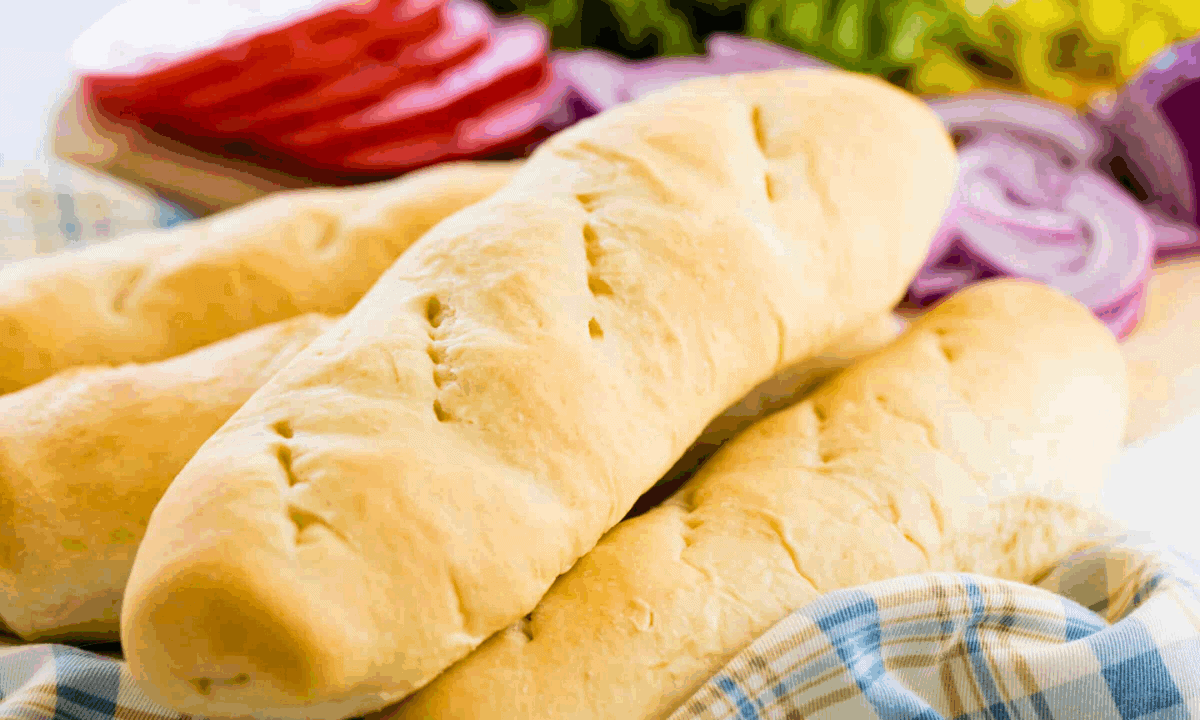A stack of homemade hoagie rolls.