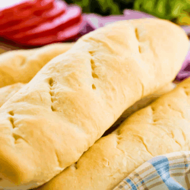 A stack of homemade hoagie rolls.