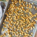 Bird's eye view of Roasted Pumpkin Seeds on a cooking sheet.