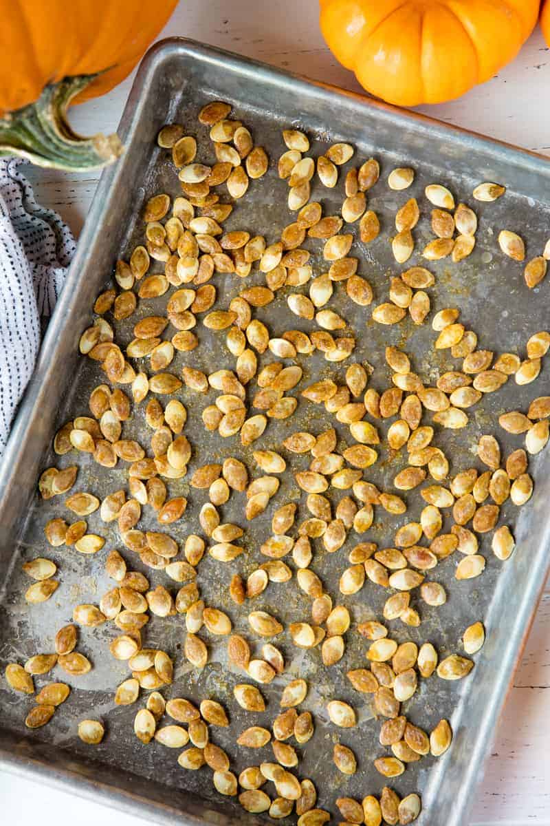 Bird's eye view of Roasted Pumpkin Seeds on a cooking sheet.