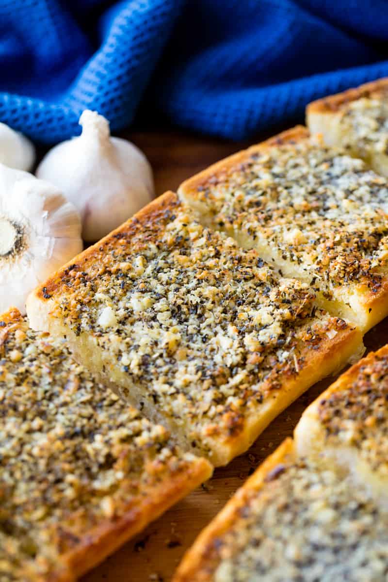 A loaf of garlic bread cut into slices.