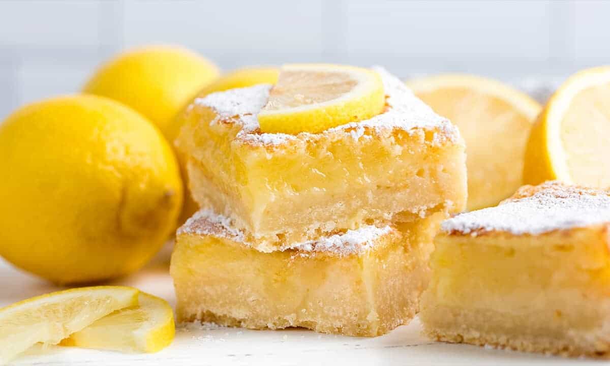 Stacked Lemon Bars with a lemon slice on top