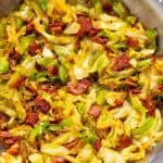 Fried Cabbage in a stainless steel pan.