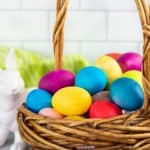 A basket full of dyed eggs.
