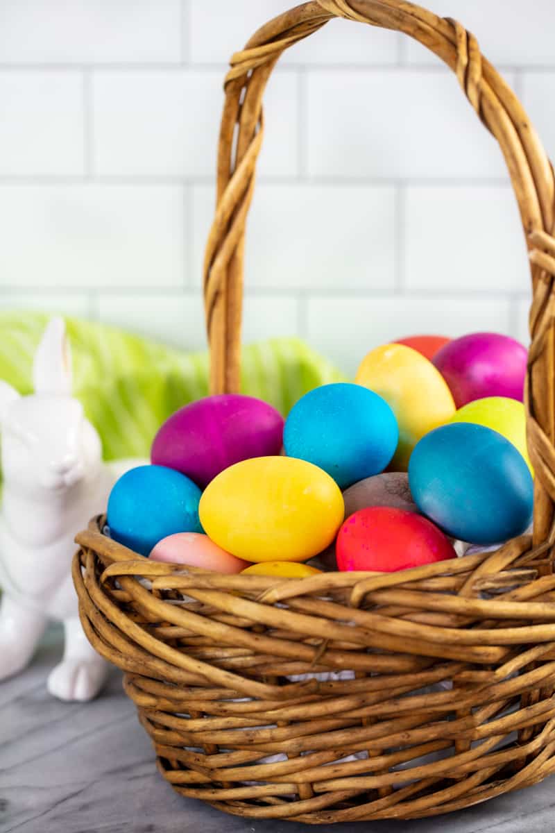 A basket full of dyed eggs.