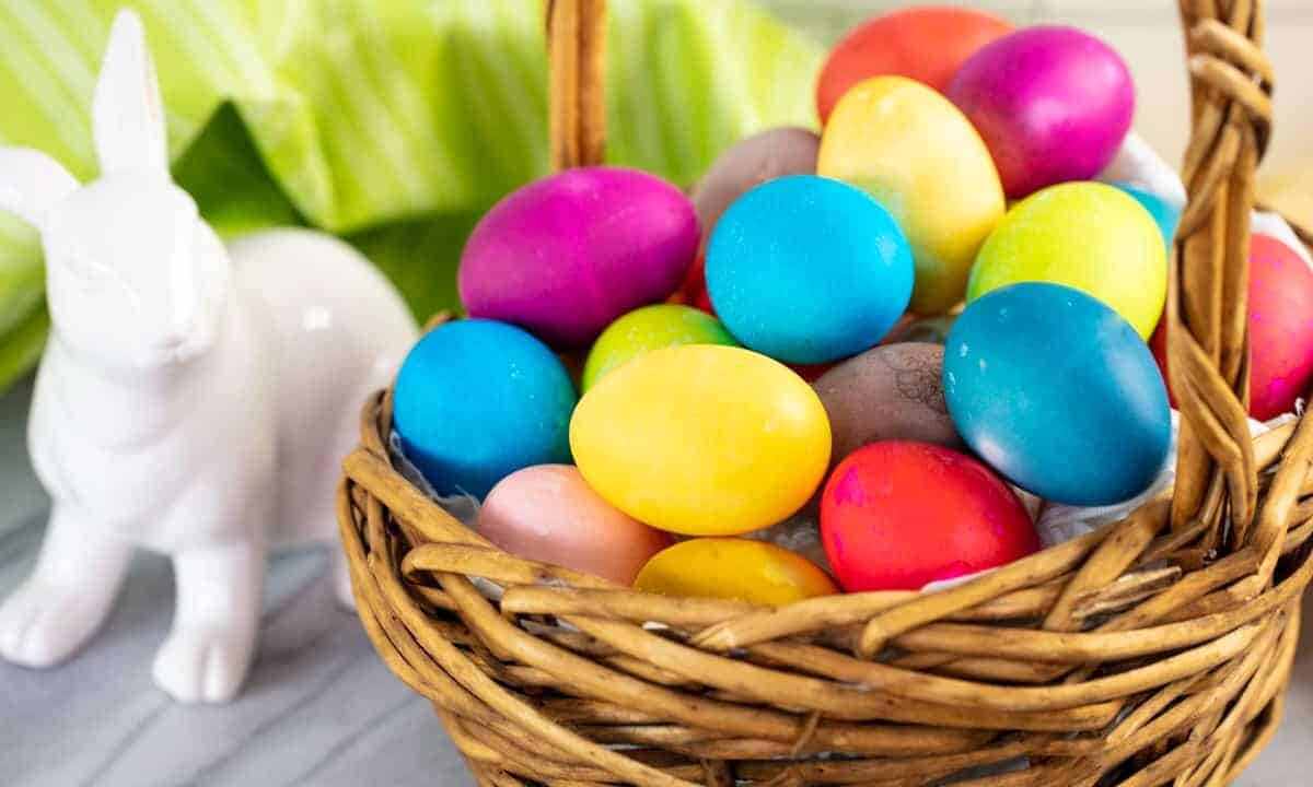 A basket full of dyed eggs.