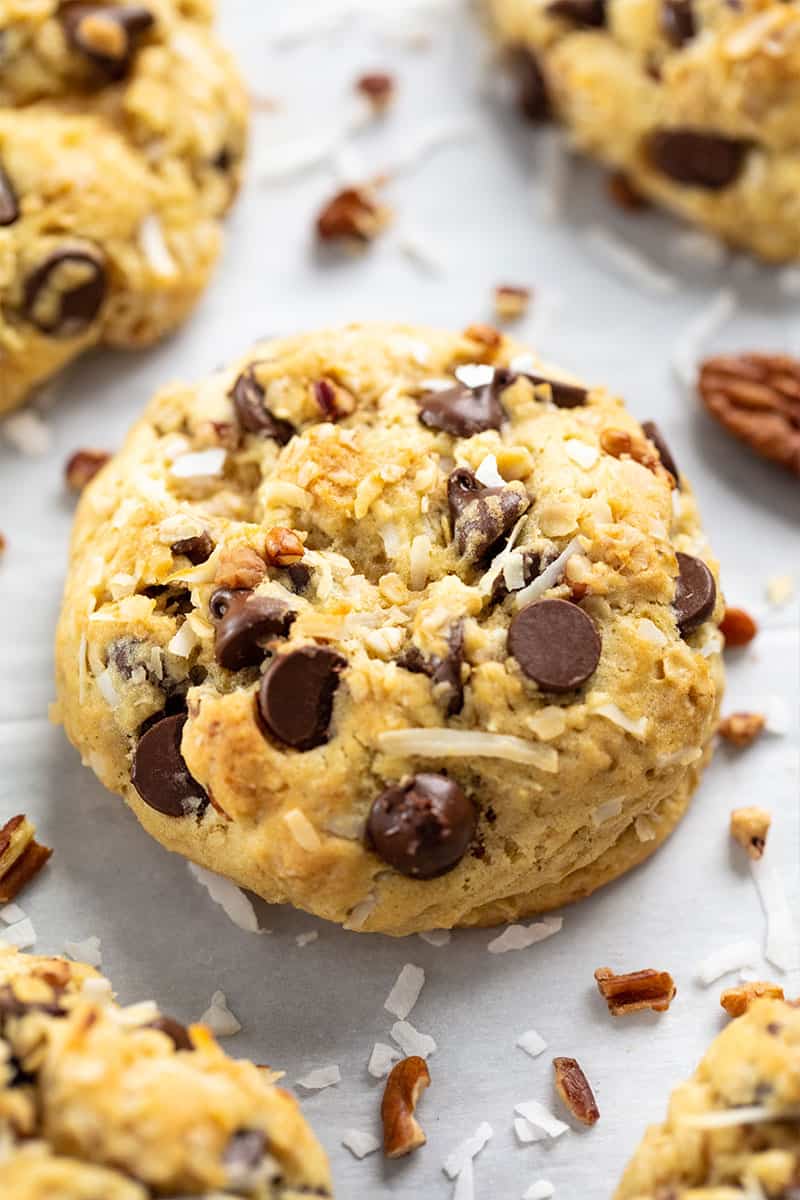 Bird's eye view of a cowboy cookie on a parchment paper.