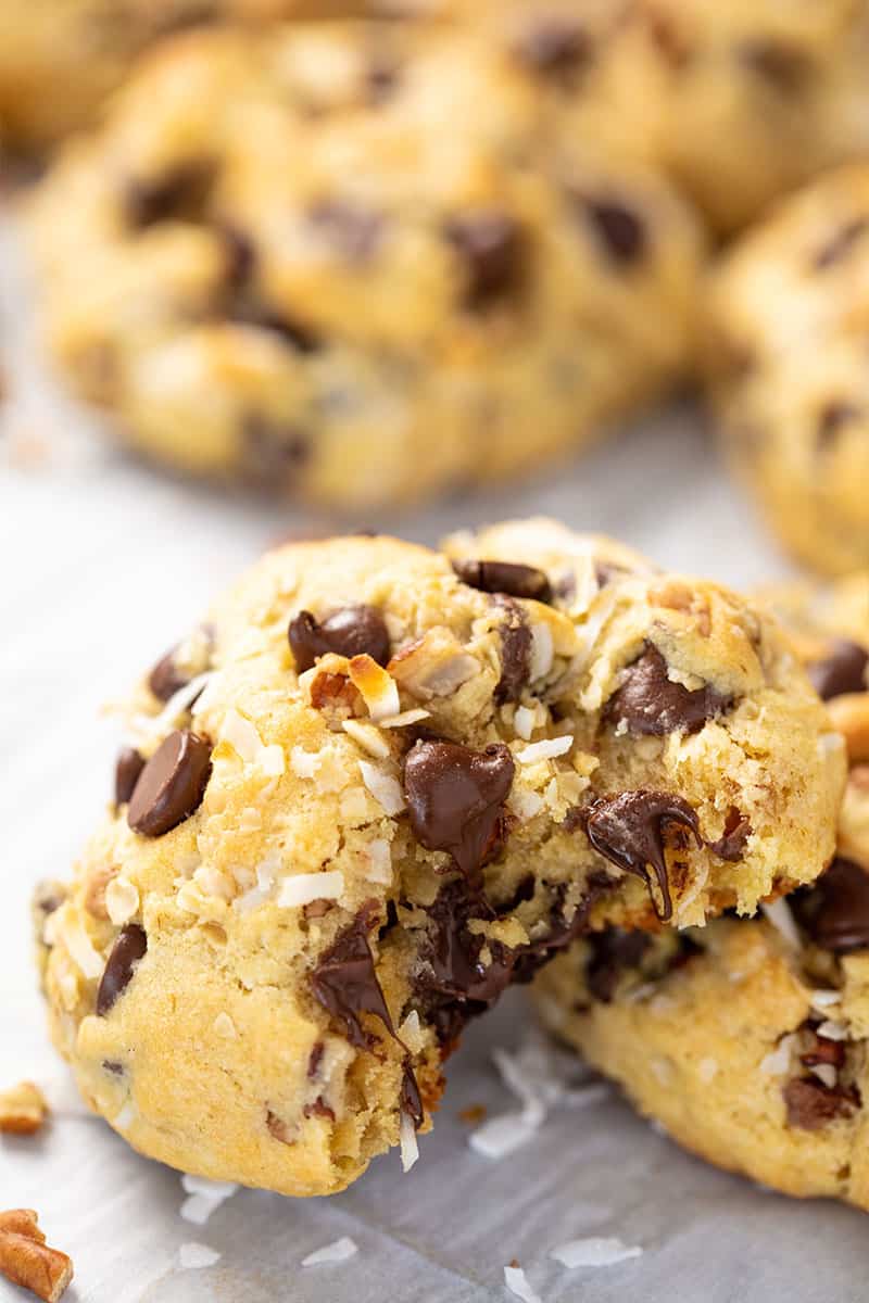 Close up of a Cowboy Cookies with a bite taken out of it.