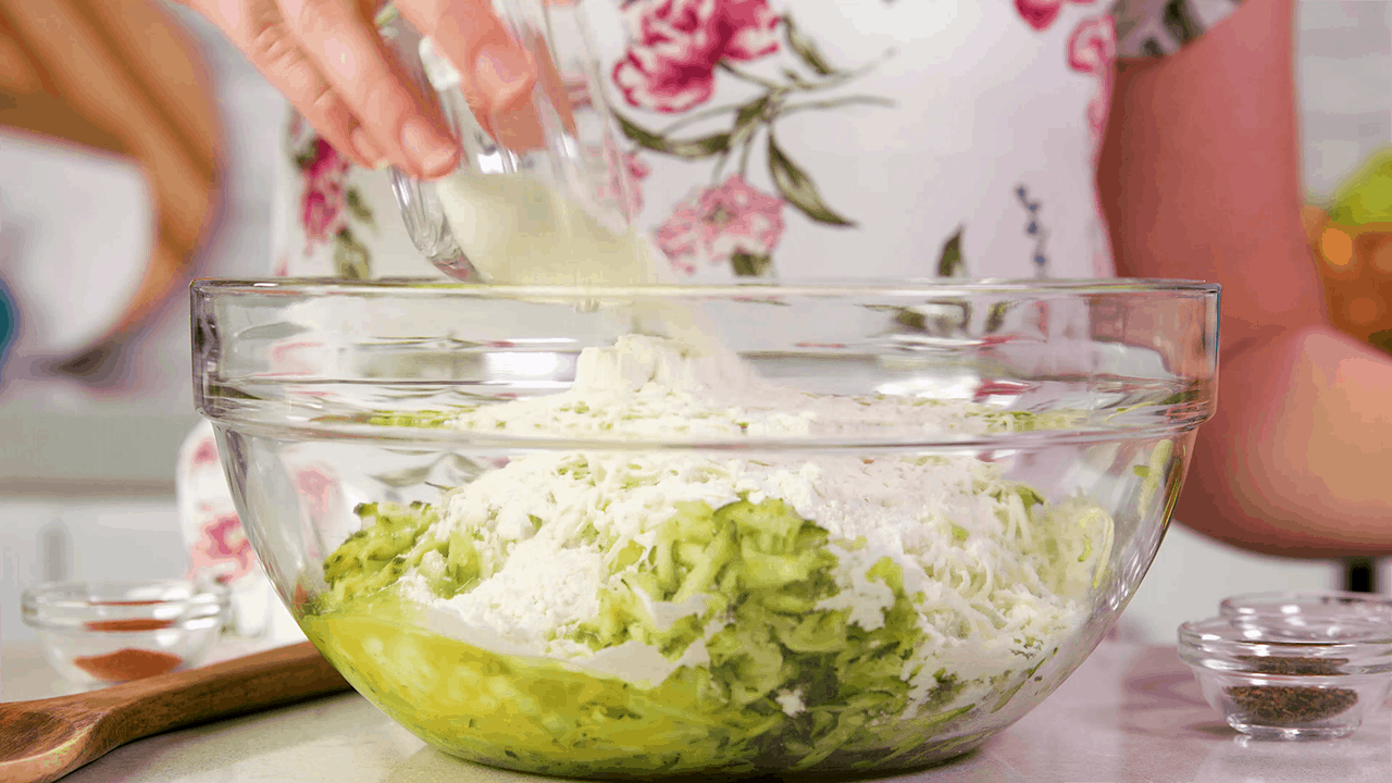 Zucchini Pancake Mixture in a glass bowl.