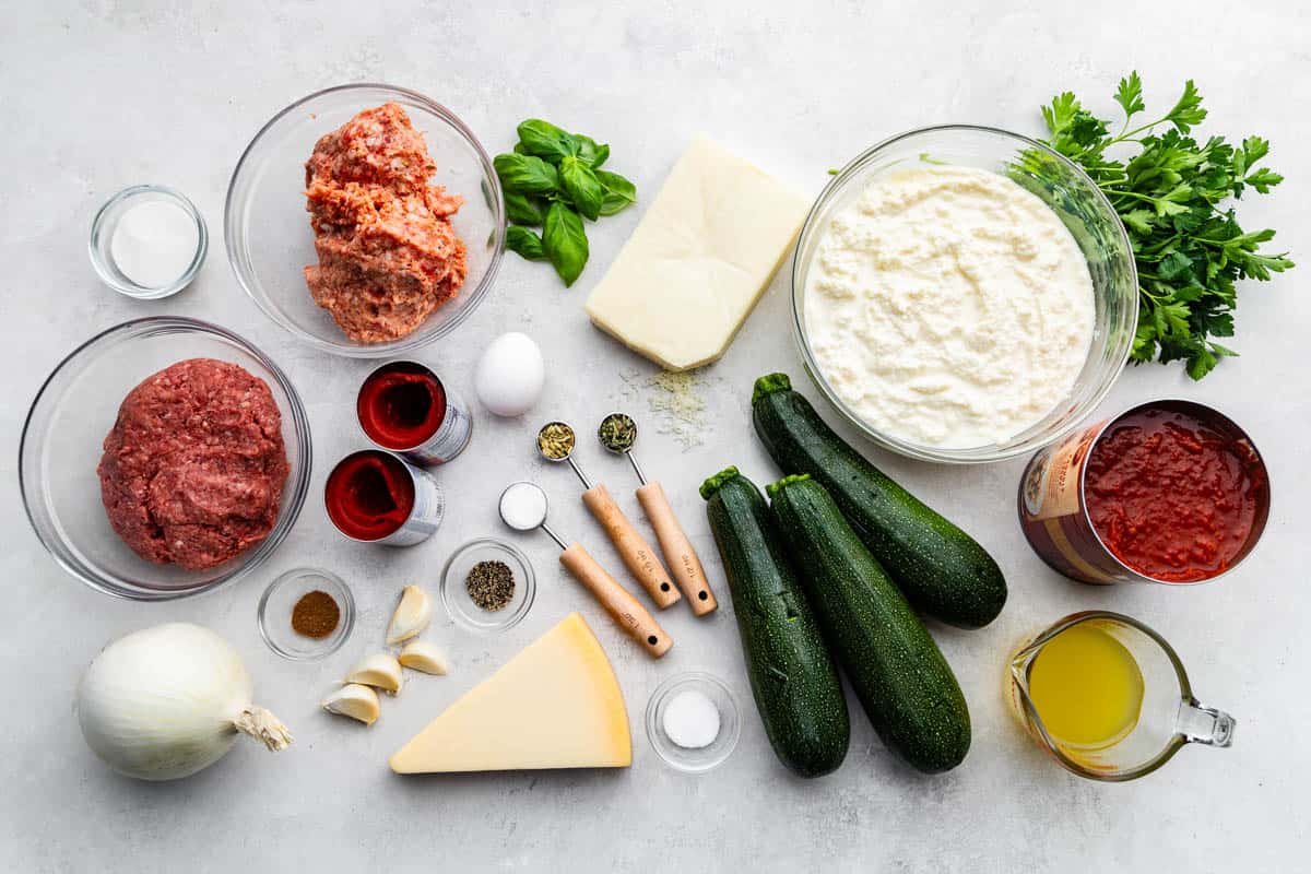 A view of all the prepped ingredients needed to make zucchini lasagna.