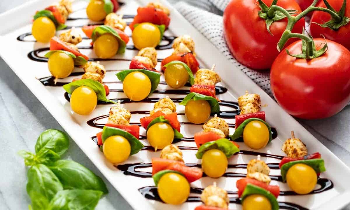 Angled view of Southwestern Caprese Bites on a white serving plate.
