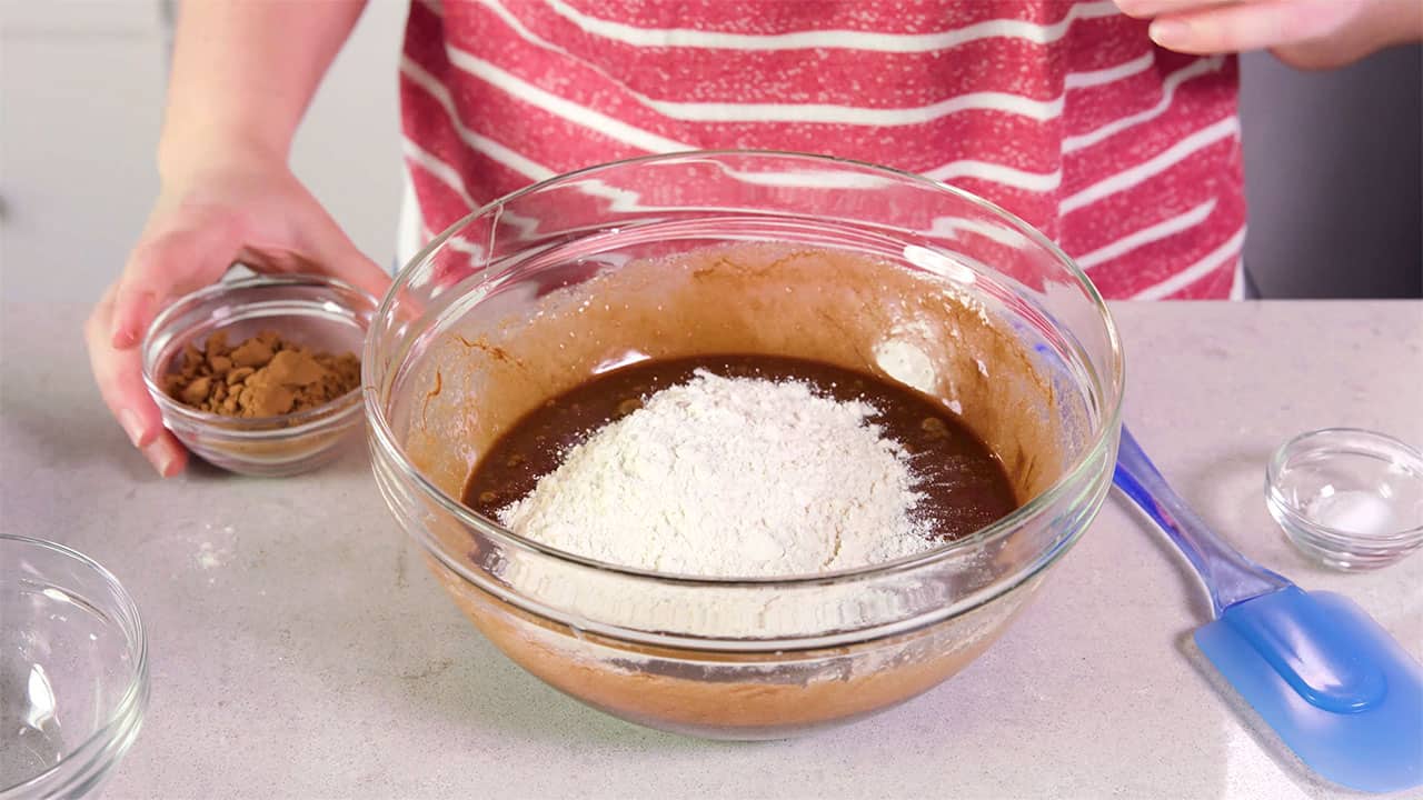 Add flour to wet ingredients in mixing bowl.