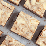 Bird's eye view of Cheesecake Brownies cut into squares.